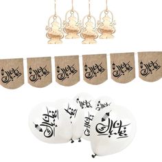 arabic calligraphy on burlap hanging decorations and judaira with bells for diwaling