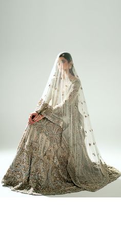 a woman in a wedding dress with a veil