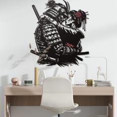 a desk with a chair and a large wall sticker on it's side