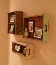 two wooden shelves with pictures on them and one has a potted plant in it