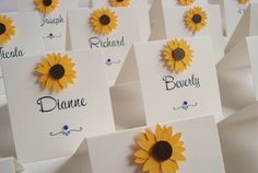 sunflower place cards with names on them