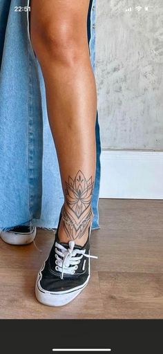 a woman's legs with tattoos on them