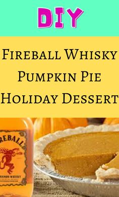 there is a pumpkin pie on the table with a bottle of whiskey next to it