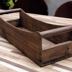 a wooden box sitting on top of a table