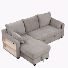 a couch with a pull out bed and storage compartment on the bottom right hand side