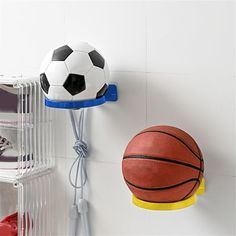 there is a basketball and ball hanging on the wall