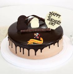 a birthday cake with chocolate icing and decorations