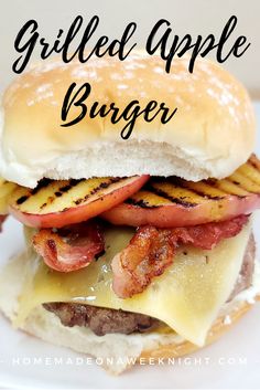 grilled apple burger with bacon and cheese on a white plate in front of the words, grilled apple burger