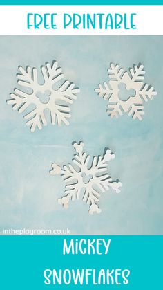 three snowflakes on a blue background with the text free printable mickey snowflakes