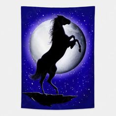 a black horse standing on its hind legs in front of a full moon and stars