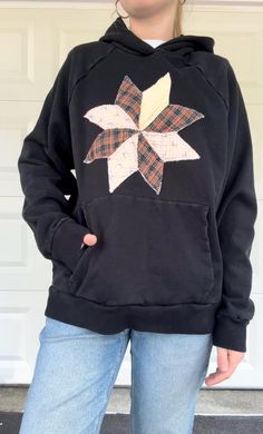 This is a one of a kind sweatshirt with a quilt star on the front used from a damaged quilt to give it a new life! Perfect for the approaching fall season! Size M Model: size S 5ft 4in Cotton Long Sleeve Sweatshirt With Star Patch, Fall Star Print Cotton Sweatshirt, Fall Cotton Sweatshirt With Star Print, Fall Cotton Sweatshirt With Star Patch, Black Quilt, New Life, Labour Day, Gender Neutral, Art Collection