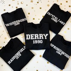 Hi I'm Melanie and welcome to my shop!  All items are handmade by me and made just for you. Please reach out to me if you have any questions!  Horror Movies Varsity Sweatshirt: It, Nightmare on Elm Street, Scream, Halloween, Friday the 13th, Chucky Inspired by all your favorite horror killers, each sweater features the location and the year the movie was released.  On the left sleeve there's a tiny representation of your favorite killer.  Sweaters are black with white and red vinyl but please contact me if you're interested in customization!  All items are handmade by me. Please expect a processing time of up to 5 business days before item is shipped.  It: Derry, 1990, Pennywise's Balloon Nightmare on Elm Street: Springwood, 1984, Freddy's Glove Scream: Woodsboro, 1996, Ghostface Halloween Black Crew Neck Hoodie For School Spirit, Black Sweatshirt For School Spirit Fan Merchandise, Scream Woodsboro, Horror Killers, Halloween Friday The 13th, Chucky Halloween, Novelty Handbags, Scream Halloween, Varsity Sweatshirt