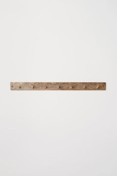 a piece of wood that is on the wall