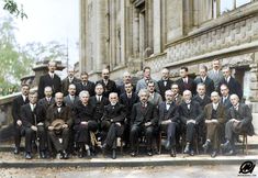 an old photo of men in suits and ties posing for a group photograph on steps