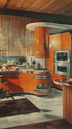 an orange kitchen with stainless steel appliances and wood paneled walls is pictured in this image