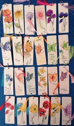 some cards with flowers and butterflies on them