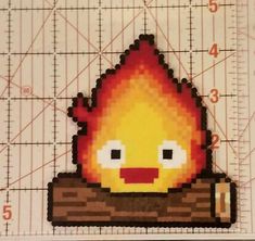 a pixelated fire sticker is shown on a ruler