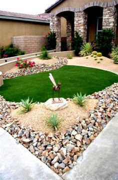 a small yard with grass and rocks in it