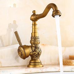 a golden faucet with water running from it