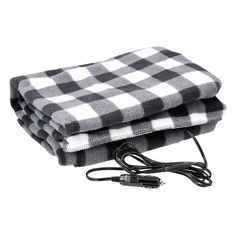 two black and white checkered blankets sitting next to each other on top of a charger