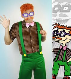 a man with red hair and glasses is wearing green suspenders while standing next to a cartoon character