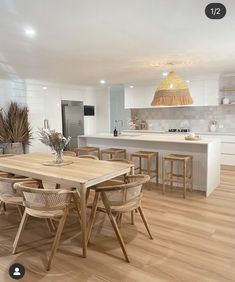 an image of a modern kitchen setting with wood flooring