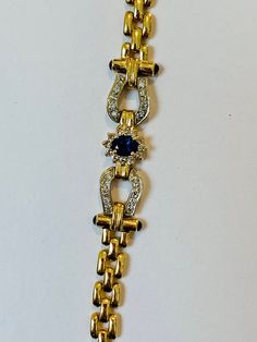 Stunning Vintage 14K White and Yellow Gold Diamond Sapphire Bracelet: Stunning Genuine Diamonds and Natural Sapphires Sapphire(s): 1.25CT Diamond(s): 0.80CT Color: F Clarity: SI1 Total Bracelet Weight: 17.5GR Bracelet Length: 7in Bracelet Width: 1cm 14K White and Yellow Gold For more information regarding this item feel free to reach me so I can accommodate your needs. Thank you Exquisite Yellow Gold Diamond Bracelet For Formal, Exquisite Yellow Gold Diamond Bracelet For Formal Occasions, Exquisite Hallmarked Bracelets For Formal Occasions, Exquisite Hallmarked Bracelet For Formal Occasions, Gold Diamond Bracelet With Accents For Evening, Elegant Formal Hallmarked Bracelets, Exquisite 14k Gold Bracelets For Formal Events, Exquisite 14k Gold Bracelets For Formal Occasions, Yellow Gold Diamond Bracelet For Evening