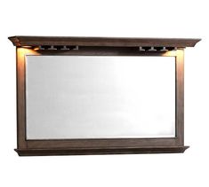 a large mirror with lights on the sides and a shelf below it that is made out of wood