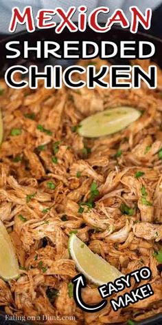 shredded chicken in a skillet with limes and cilantro on the side