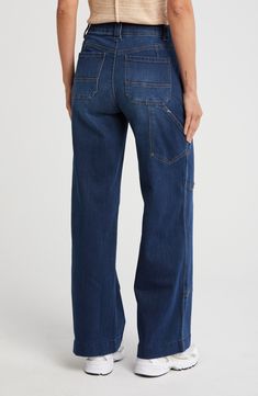 Cut from stretch denim, these wide-legged jeans keep you looking sharp and feeling comfortable from day to night. 32" inseam; 24 1/2" leg opening; 11" front rise; 15 1/2" back rise Zip fly with button closure Front slant pockets 95% cotton, 4% polyester, 1% spandex Machine wash, tumble dry Imported Wide Legged Jeans, Concert Looks, Tom Ford Sunglasses, Preppy Look, Fitted Suit, Kids Outerwear, Day To Night, Sweaters And Leggings, Short Suit