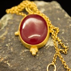 Ancient Art Red Jade Stone Necklace 925 Sterling Silver 24K Gold Plated Handcrafted Necklace Pendant Minimalist Jewelry By Pellada Ancient Art Red Jade Stone pendant made 24k gold plated 925 sterling silver. OUR NECKLACES ARE SOLD WITH THE CHAIN. Metal : 925 Sterling Silver Gemstone : Red Jade Stone Gem Size : 5.50 x 2.00 mm Chain Material : 925 Sterling Silver (24K Gold Plated) Chain Lenght : 46 cm(18.11 in) Pendant Weight : 9.20 gr **Custom Orders is Made** As pellada family, we will be happy Traditional Gold Cabochon Necklaces, Red Ruby Cabochon Necklace, Gold Oval Ruby Necklace, Oval Ruby Gold Necklace, Handmade 22k Gold Necklaces For Formal Events, Handmade 22k Gold Necklaces For Formal Occasions, Formal Handmade 22k Gold Necklace, Gold Spiritual Necklace With Cabochon, Gold Ruby Necklace With Spiritual Style