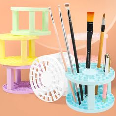 there are many different types of makeup brushes in this holder