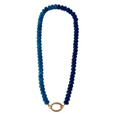 This necklace is a versatile and stylish piece of jewelry that offers three different looks in one design. It features shades of blue rondelle beads, complemented by a circular gold clasp that allows for the addition of charms. The necklace measures approximately 17 inches in length. The rondelle beads are small, cylindrical-shaped beads with faceted surfaces, adding texture and dimension to the necklace. The combination of two shades of blue creates a sophisticated and versatile color palette t Blue Single Strand Necklace With Oval Beads, Blue Beaded Everyday Necklace, Everyday Blue Beaded Necklaces, Everyday Blue Beaded Necklace, Blue Rondelle Faceted Bead Necklaces, Blue Rondelle Beaded Necklace With Faceted Beads, Blue Rondelle Beaded Necklace With Spacer Beads, Blue Rondelle Faceted Bead Necklace, Blue Beaded Necklace With Colorful Beads For Everyday