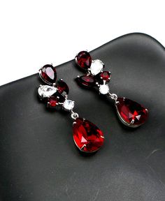 Tarnish resistant rhodium silver plated metal framed swarovski siam red teardrop earrings with swarovski siam red rhinestone and clear white cz two tone multi-shape post earrings. Earring posts are surgical steel.. Size: 4cm x 1.2cm Matching necklace available. Please inquire. Jewelry Bridesmaid, Earring Posts, Clear White, Red Rhinestone, Red Crystals, Matching Necklaces, Gift Wedding, Bridesmaid Gift, Wedding Earrings