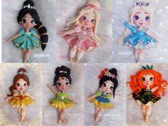 there are six little dolls that have different hair colors and designs on them, each one is wearing a tiara