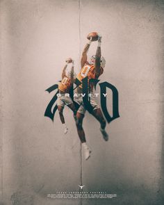 two football players jumping up into the air