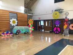 an indoor gym with various decorations on the floor