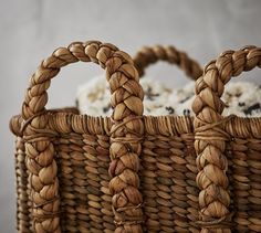 a close up of a basket with some food in the back and on the side