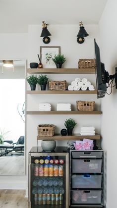 the shelves in this kitchen are filled with various items