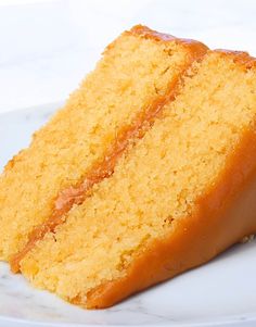 a piece of yellow cake on a white plate