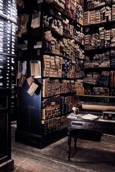 a room filled with lots of books and boxes