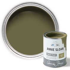 an open can of annie sloan's chalk paint next to a tin of brown