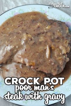 a close up of a plate of food with gravy on it and the words crock pot poor man's steak with gravy