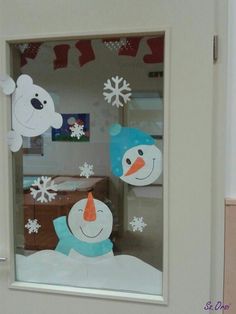 there is a snowman and polar bear in the window