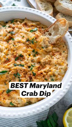 the best maryland crab dip recipe is in a white dish with bread and parsley