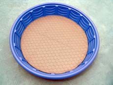 a close up of a blue bowl on a table