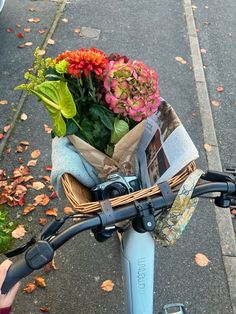 a bicycle with flowers on the handlebars