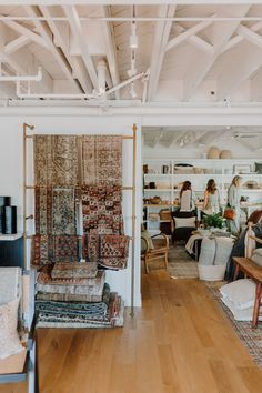 a room filled with lots of furniture and rugs