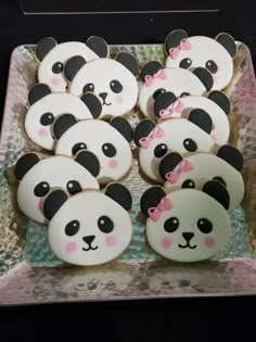 there are many decorated cookies in the shape of pandas