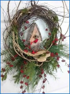 a wreath with an ornament hanging from it